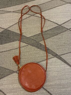 American Apparel Round Crossbody Bag in Rust Brown with Tassel